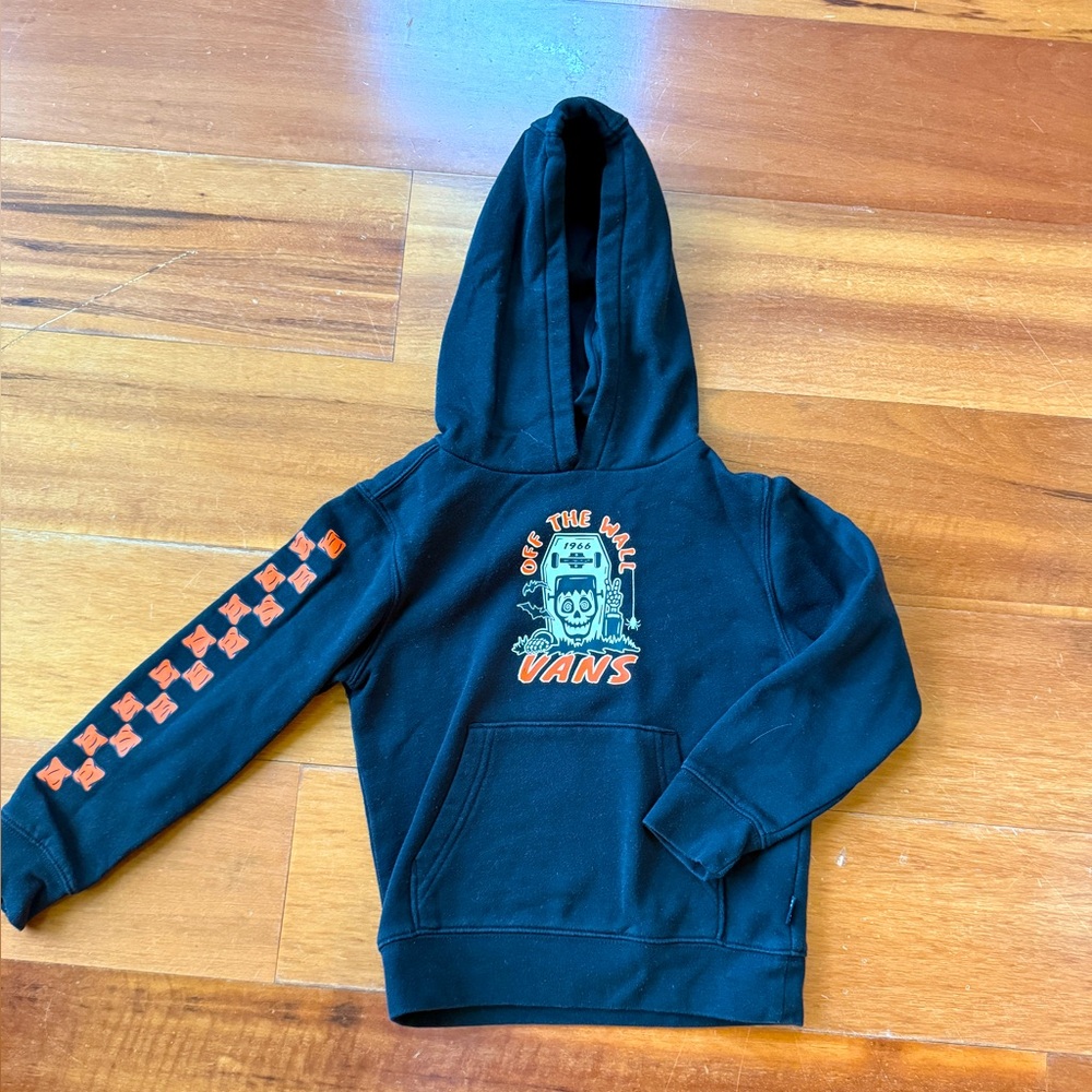 Vans Black Hoodie awesome for Halloween. 
Glows in the Dark!